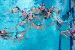 happy children group  at swimming pool photo