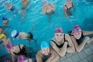 happy children group  at swimming pool photo