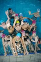 happy childrens at swimming pool photo