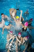 happy childrens at swimming pool photo