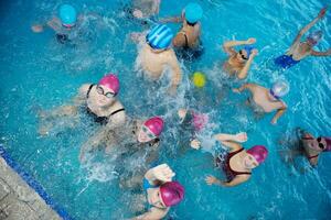 happy childrens at swimming pool photo