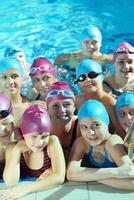 happy children group  at swimming pool photo