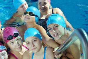 happy children group  at swimming pool photo