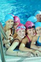 happy children group  at swimming pool photo