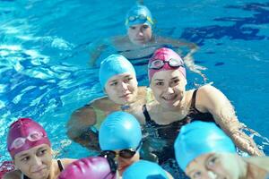 happy children group  at swimming pool photo