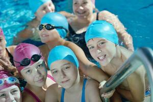 happy children group  at swimming pool photo