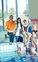 happy children group  at swimming pool photo