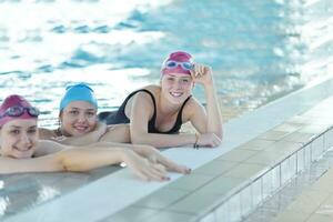 happy children group  at swimming pool photo