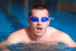 .man in swimming pool photo