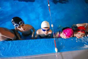 .childrens in serie at swimming pool photo