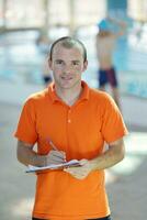 happy children group  at swimming pool photo