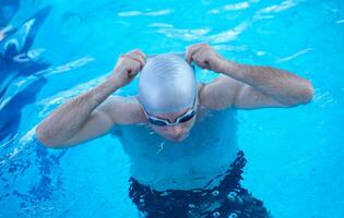 swimmer excercise on indoor swimming poo photo