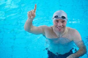 swimmer excercise on indoor swimming poo photo