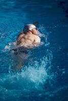 swimmer excercise on indoor swimming poo photo
