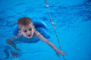 child on swimming poo photo
