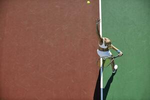 young woman play tennis outdoor photo