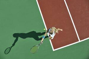 young woman play tennis outdoor photo