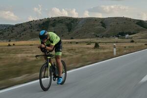 triathlon athlete riding bike photo