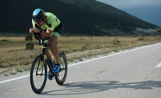 triathlon athlete riding bike photo