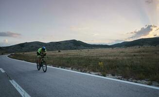 triathlon athlete riding bike photo