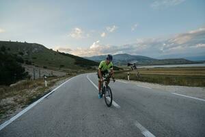 triathlon athlete riding bike photo