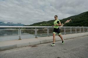 triathlon athlete running on street photo