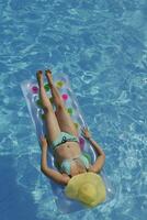 woman relax at swimming pool photo