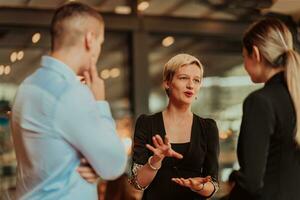 Photo of a business team of young people discussing business ideas in a modern urban environment. Selective focus