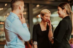 Photo of a business team of young people discussing business ideas in a modern urban environment. Selective focus