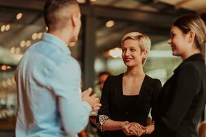 Photo of a business team of young people discussing business ideas in a modern urban environment. Selective focus