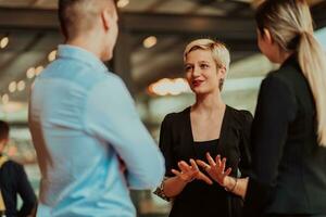 Photo of a business team of young people discussing business ideas in a modern urban environment. Selective focus