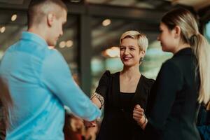 Photo of a business team of young people discussing business ideas in a modern urban environment. Selective focus