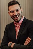 Portrait of a young businessman in a modern suit. Portrait of the company director in his office. Selective focus photo