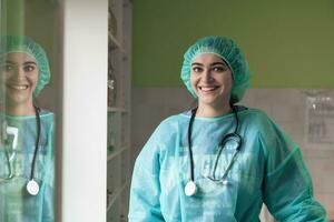 portrait of the female surgeon after an operation on animal hospital clinic surgery room photo