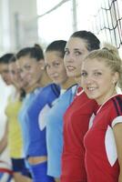 girls playing volleyball indoor game photo