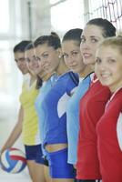 girls playing volleyball indoor game photo