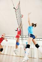 girls playing volleyball indoor game photo