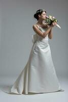 bride with a bouquet  isolated on white background photo