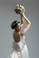 bride with a bouquet  isolated on white background photo