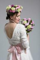 bride with a bouquet  isolated on white background photo