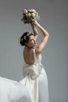 bride with a bouquet  isolated on white background photo