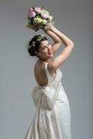 bride with a bouquet  isolated on white background photo