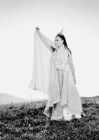 Beautiful bride outdoors in black and white photo