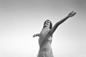 Beautiful bride outdoors in black and white photo