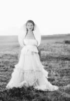 Beautiful bride outdoors in black and white photo