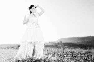 Beautiful bride outdoors in black and white photo
