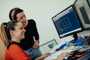 Within the heavy industry, a factory industrial engineer measures with a caliper and on a personal computer Designs a 3D model photo