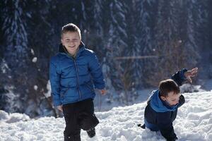 kids playing with  fresh snow photo