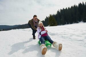 happy young couple having fun on fresh show on winter vacation photo