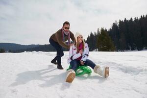 happy young couple having fun on fresh show on winter vacation photo